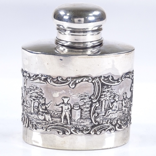 601 - A late Victorian oval silver tea caddy, with relief embossed lover scenes, by Levi & Salaman, hallma... 