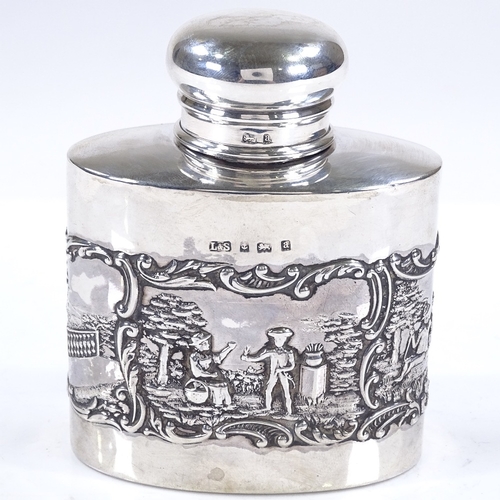 601 - A late Victorian oval silver tea caddy, with relief embossed lover scenes, by Levi & Salaman, hallma... 