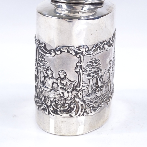 601 - A late Victorian oval silver tea caddy, with relief embossed lover scenes, by Levi & Salaman, hallma... 