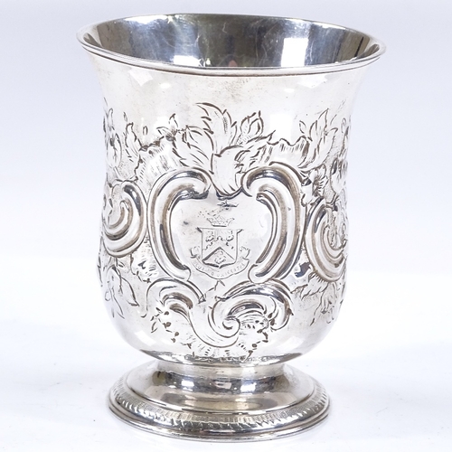 602 - An early 19th century silver fluted beaker, with relief embossed foliate and floral decoration, make... 