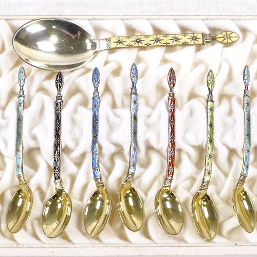 611 - A set of 12 Norwegian sterling silver-gilt and coloured enamel coffee spoons, and matching caddy spo... 