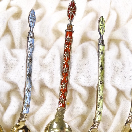 611 - A set of 12 Norwegian sterling silver-gilt and coloured enamel coffee spoons, and matching caddy spo... 