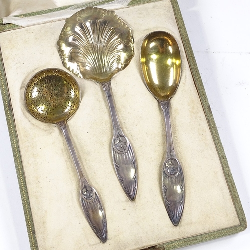 612 - A 19th century French silver strawberries and cream set, comprising strawberry spoon, cream ladle, a... 