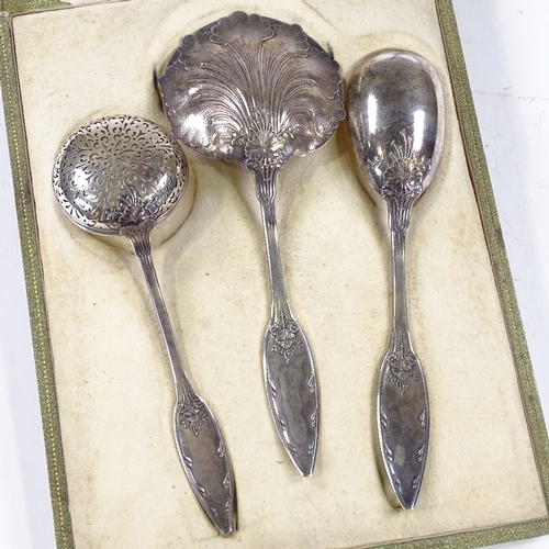 612 - A 19th century French silver strawberries and cream set, comprising strawberry spoon, cream ladle, a... 