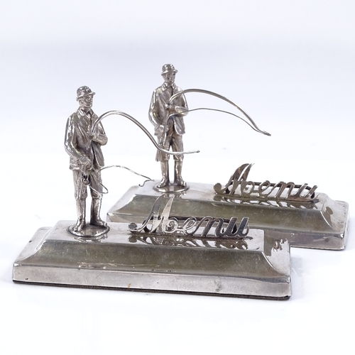 618 - A pair of silver menu holders, designed as fly fishermen, by Henry Williamson Ltd, hallmarks Birming... 