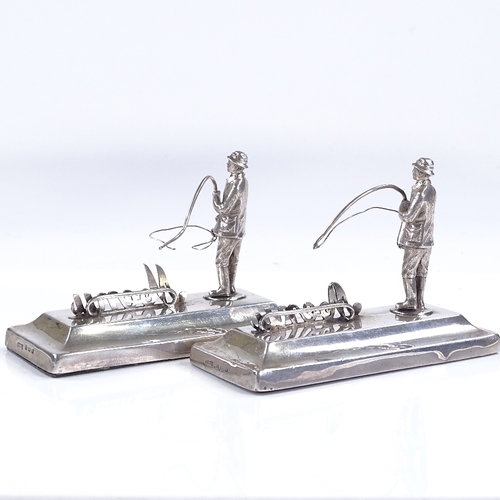 618 - A pair of silver menu holders, designed as fly fishermen, by Henry Williamson Ltd, hallmarks Birming... 