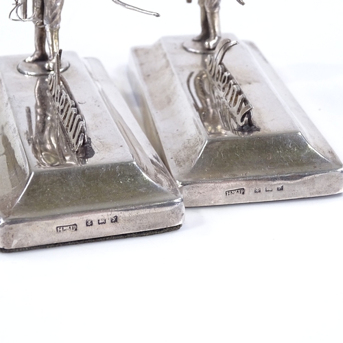 618 - A pair of silver menu holders, designed as fly fishermen, by Henry Williamson Ltd, hallmarks Birming... 