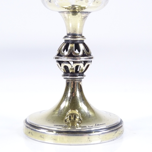 647 - A Swedish silver-gilt goblet, with hand planished finish and pierced globe stem, by Erik Lofman, hal... 