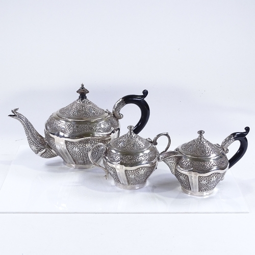 657 - An Indian/Burmese unmarked silver 3-piece tea set, with all over relief embossed leaf decoration, te... 