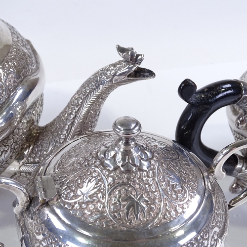 657 - An Indian/Burmese unmarked silver 3-piece tea set, with all over relief embossed leaf decoration, te... 