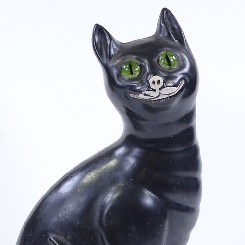 105 - A Galle style black glaze pottery cat with green glass eyes, height 33cm