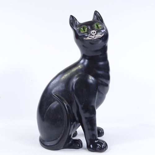 105 - A Galle style black glaze pottery cat with green glass eyes, height 33cm