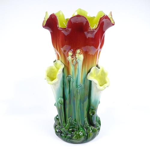 108 - A Majolica Pottery stick stand with 3 side vases, indistinct factory marks under base, height 63cm