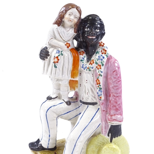 111 - A Staffordshire figure of Uncle Tom, height 27cm