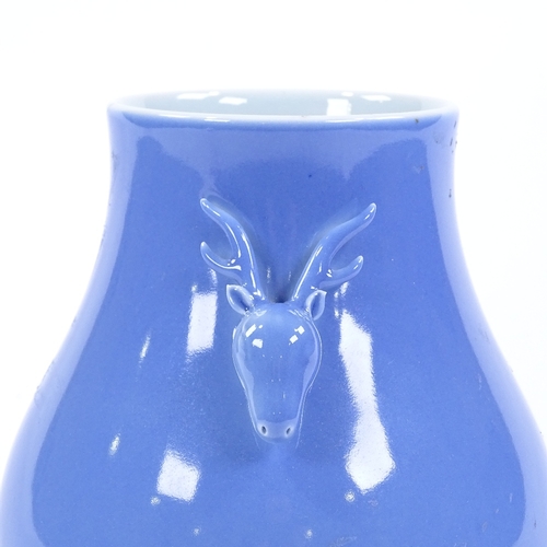 114 - A Chinese blue glaze porcelain vase with stag design handles, height 17cm, seal mark under base