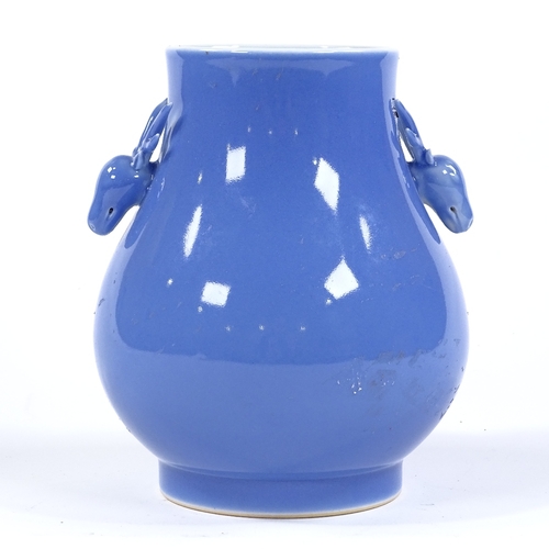 114 - A Chinese blue glaze porcelain vase with stag design handles, height 17cm, seal mark under base