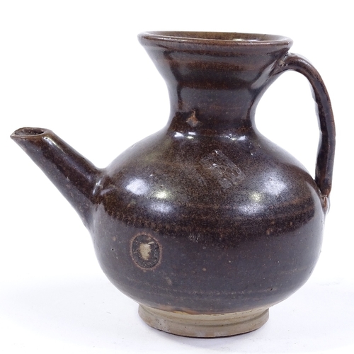 119 - A Chinese dark brown glaze jar with spout, height 11cm