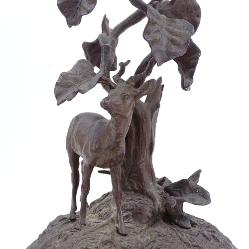 129 - A patinated bronze antelope standing under a tree, circa 1900, unsigned, height 20cm