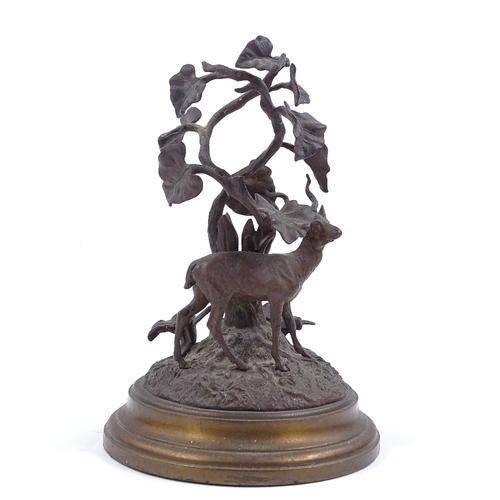 129 - A patinated bronze antelope standing under a tree, circa 1900, unsigned, height 20cm