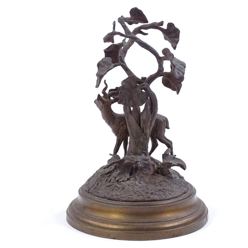 129 - A patinated bronze antelope standing under a tree, circa 1900, unsigned, height 20cm