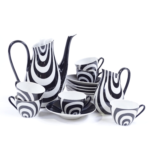 133 - Chodziez - Poland, a rare coffee set in black and white, hand painted and signed by B Opacki, dated ... 