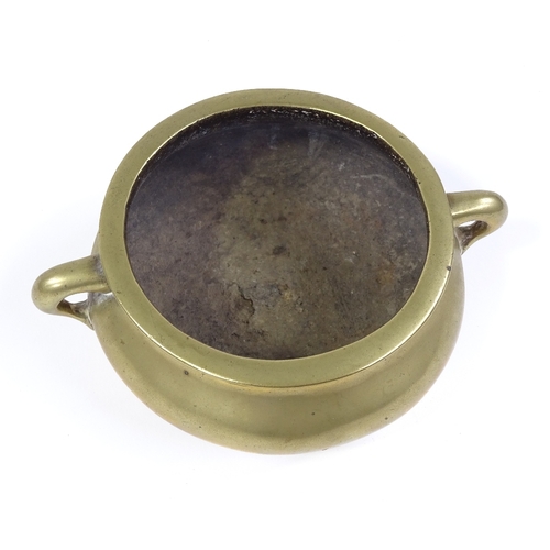 21 - A Chinese bronze 2-handled censer, impressed 6 character seal mark under base, rim diameter 12cm, he... 