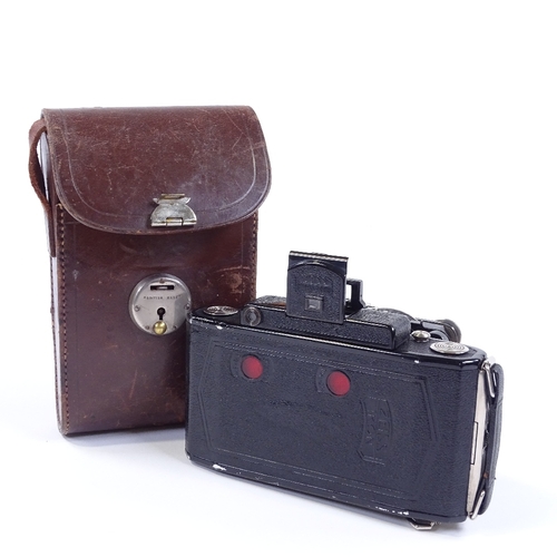 25 - A Zeiss Ikon Super Ikonta folding camera, leather-cased
