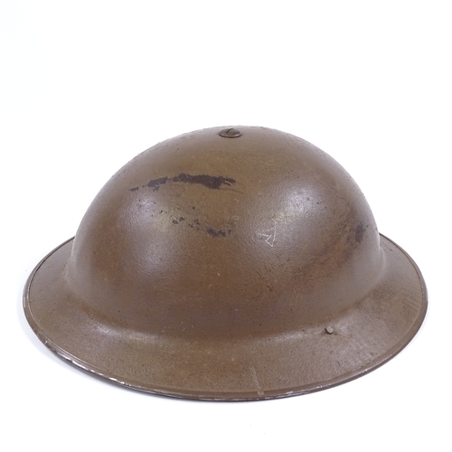 40 - A Second War Period British Army tin helmet dated 1938