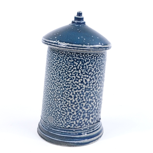 63 - Walter Keeler (British born 1942), a blue salt glaze leaning storage jar and cover, height 17cm