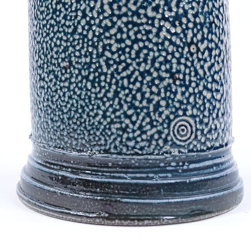 63 - Walter Keeler (British born 1942), a blue salt glaze leaning storage jar and cover, height 17cm