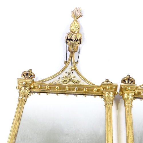 70 - A pair of Italian carved and gilded gesso-framed wall mirrors, with gilded verre eglomise inset pedi... 