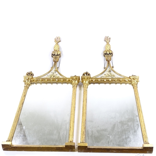 70 - A pair of Italian carved and gilded gesso-framed wall mirrors, with gilded verre eglomise inset pedi... 