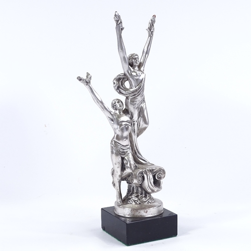 75 - A silver patinated bronze Classical sculpture depicting 2 figures holding laurel wreaths, on marble ... 