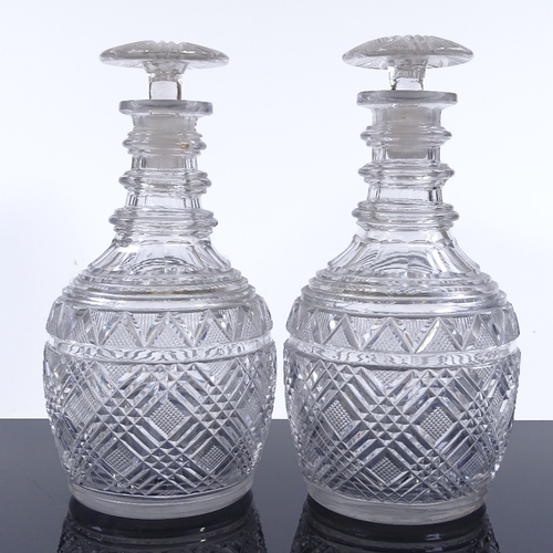 76 - A pair of 19th century cut-glass decanters with neck rings and mushroom stoppers, height 24cm