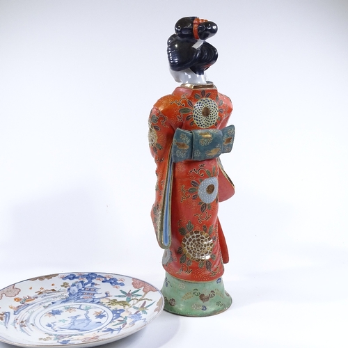 82 - A Japanese porcelain standing figure with painted and gilded robes, height 60cm, and a Japanese pain... 