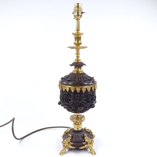 84 - A modern patinated and parcel gilt-bronze table lamp, with relief moulded Classical designs, height ... 