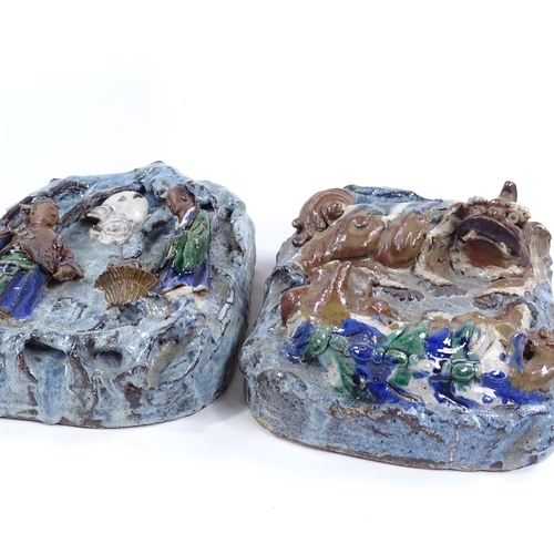 85 - A pair of Chinese Shiwan multi-colour glaze porcelain wall pockets, with relief moulded dogs of fo a... 