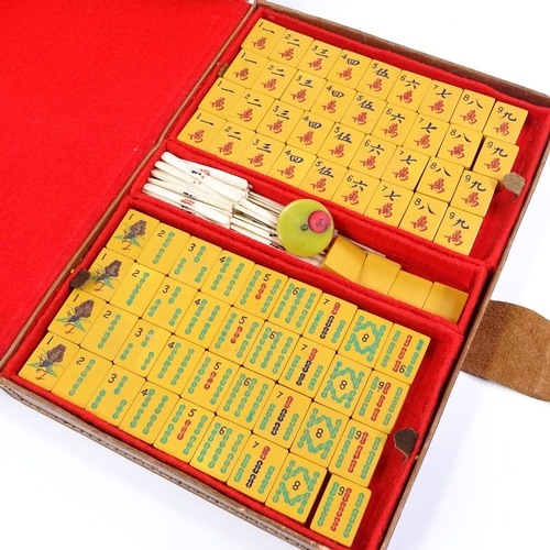 87 - A Chinese Bakelite Mahjong set in leather case