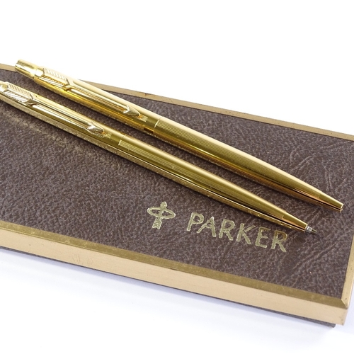 94 - A Parker gold plated ballpoint pen and propelling pencil set, new and unused condition, boxed