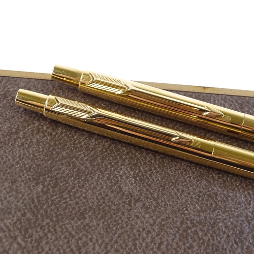 94 - A Parker gold plated ballpoint pen and propelling pencil set, new and unused condition, boxed