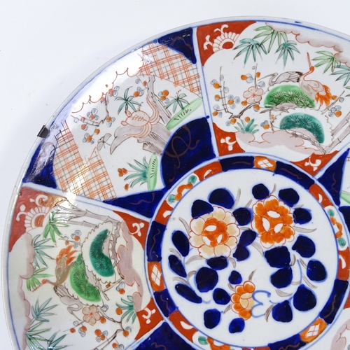 110 - A large Chinese porcelain charger with hand painted decoration, diameter 45cm