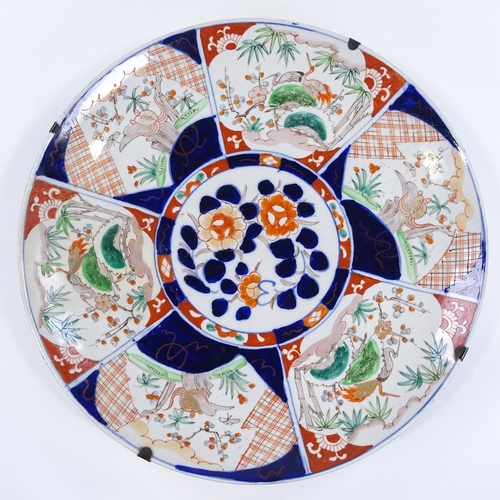 110 - A large Chinese porcelain charger with hand painted decoration, diameter 45cm