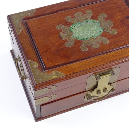 117 - A Chinese brass-bound mahogany jewel box, with inset green stone plaque to the lid, width 30cm