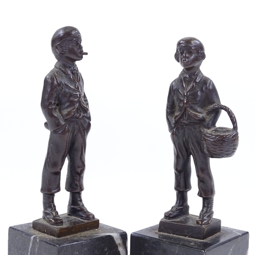 119 - A pair of miniature bronze figures of Italian street urchins, circa 1900, on black marble bases, uns... 