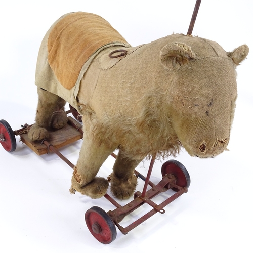 122 - An Antique Steiff straw-filled ride-on soft toy lion, with growler, length 50cm