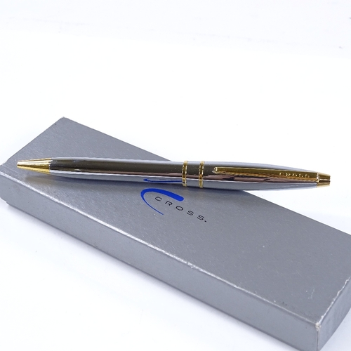 124 - A Cross ball pen, highly polished chrome/gold, new and boxed