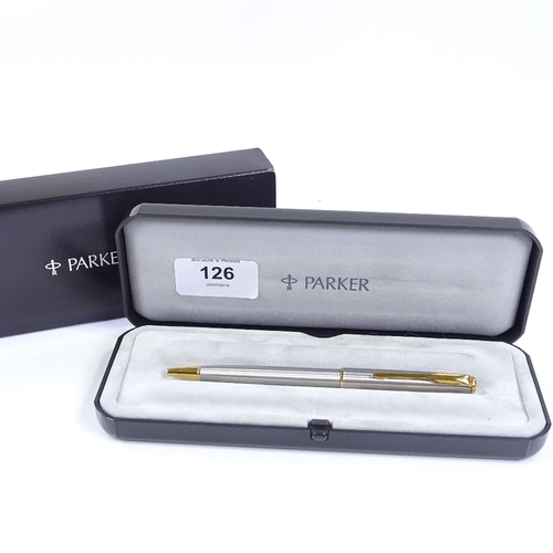 126 - A Parker Sonnet ball pen, stainless steel/gold, new and boxed