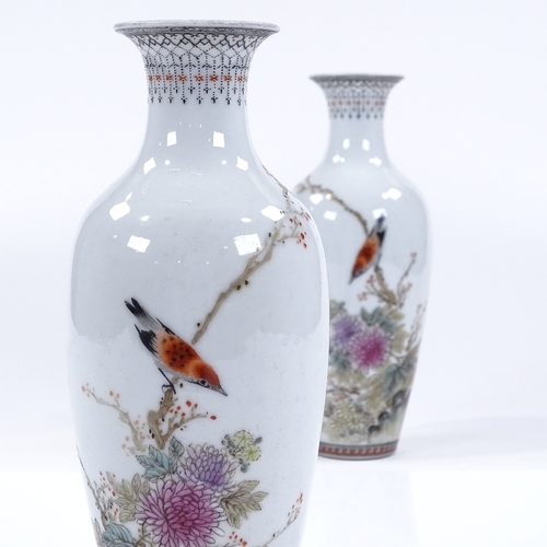 127 - A pair of Chinese white glaze porcelain vases, with hand painted birds, flowers and text, height 22c... 