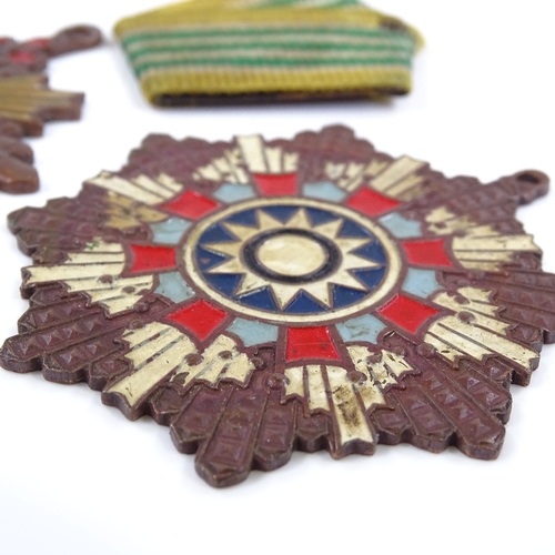 130 - 2 Taiwanese painted brass medals