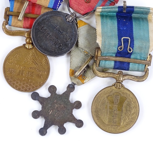 137 - 6 Second War Period Japanese medals, and a Japanese Navy badge